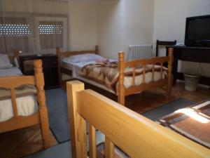 Postel nebo postele na pokoji v ubytování Hotel Le Village