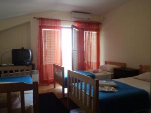 Postel nebo postele na pokoji v ubytování Hotel Le Village