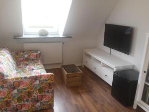 TV a/nebo společenská místnost v ubytování Familienzimmer in Kassel