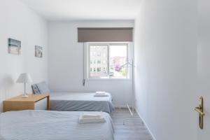 מיטה או מיטות בחדר ב-The Perfect Porto Apartment