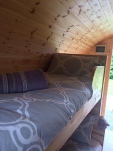 A bed or beds in a room at Coach Field Camp
