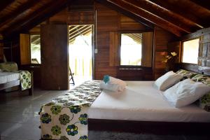 מיטה או מיטות בחדר ב-Hotel Nuquimar