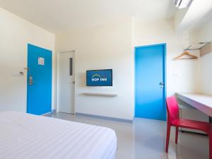 Postel nebo postele na pokoji v ubytování HOP INN Hua Hin