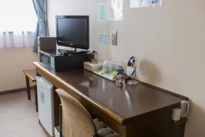 TV a/nebo společenská místnost v ubytování Hotel New Neo