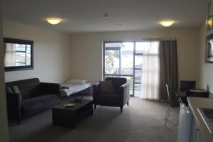 Кровать или кровати в номере Pegasus Gateway Motels & Apartments