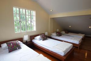 Postel nebo postele na pokoji v ubytování Charming Tagaytay Vacation Home