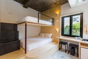 a bedroom with a bunk bed and a desk at Hotel Baroato 2nd in Seoul