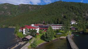 an aerial view of a hotel on the shore of a lake at Revsnes Hotel in Byglandsfjord