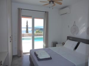 Кровать или кровати в номере Lefka's Villas