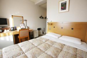 Postelja oz. postelje v sobi nastanitve Hotel Tachibana