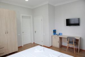 TV o dispositivi per l'intrattenimento presso Hotel Botanica