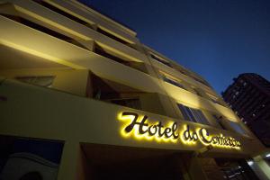 a hotel sign on the side of a building at Hotel do Comércio in Joaçaba