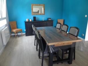 a dining room with a wooden table and chairs at Labassere in Labassère