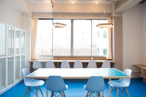 a conference room with a table and chairs at Wharf Inn in Yokohama