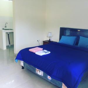Postel nebo postele na pokoji v ubytování Ady Homestay