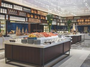 A restaurant or other place to eat at Cordis Shanghai Hongqiao (Langham Hospitality Group)