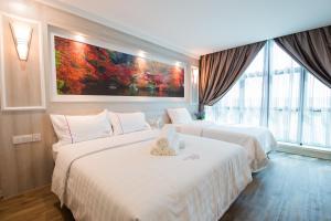 Postel nebo postele na pokoji v ubytování Lavender Inn USJ