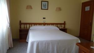 Łóżko lub łóżka w pokoju w obiekcie Hotel La Costera