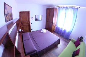 A bed or beds in a room at B&B Selvarossa