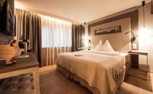 Vuode tai vuoteita majoituspaikassa Hotel Daniela