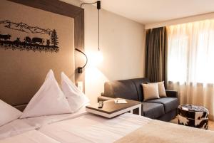 Vuode tai vuoteita majoituspaikassa Hotel Daniela