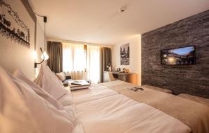 Vuode tai vuoteita majoituspaikassa Hotel Daniela