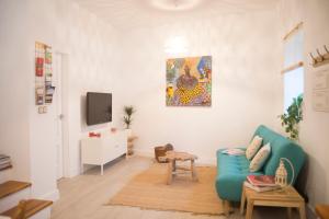 Televízia a/alebo spoločenská miestnosť v ubytovaní Triplex Panoramic Ronda