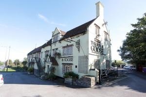 a white building with a sign on the side of it at Fox & Goose, Barrow Gurney by Marston's Inns in Bristol