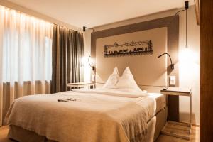 Vuode tai vuoteita majoituspaikassa Hotel Daniela