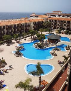 an overhead view of a resort with several pools at Balcon del Mar en la Costa in Costa Del Silencio