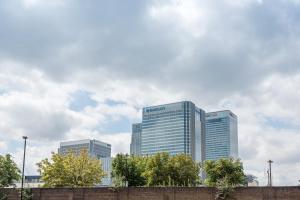 a group of tall buildings in a city at Centra Wharf in London