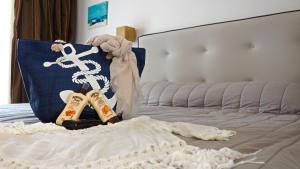 a bedroom with a bed with two pillows on it at Lagomandra Hotel and Spa in Lagomandra