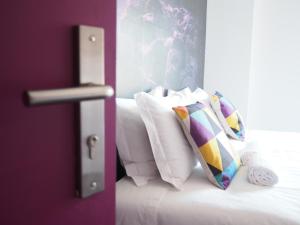 מיטה או מיטות בחדר ב-Globo Happy Hostel