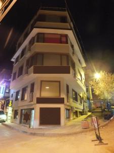 a tall building with a star on it at night at Heykel Residence in Bursa