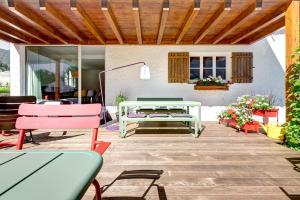 a patio with tables and chairs and a table at Hotel Lün in Brand