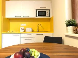 Kuchyň nebo kuchyňský kout v ubytování Apartmány Pinie Lipno