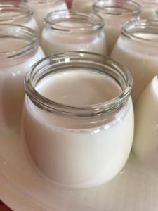 a group of jars of milk on a table at Hotel Villa Selene in Lanusei