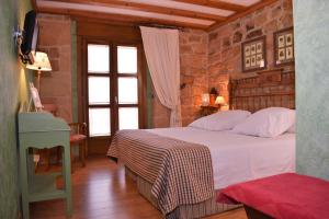 Un pat sau paturi într-o cameră la Posada Las Mayas