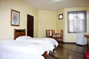 Giường trong phòng chung tại Ana Maria Apart Hotel