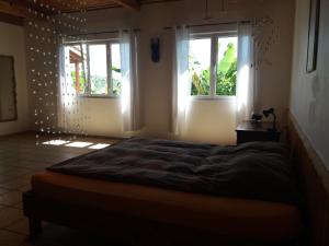 Postel nebo postele na pokoji v ubytování Casa Farrobo