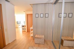 a living room with a sliding glass door at IN24 in Palanga +7 photos