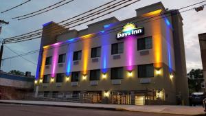 a hotel with a sign on the side of it at Days Inn by Wyndham Brooklyn Marine Park in Brooklyn