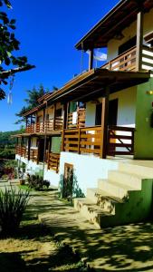 a large building with stairs in front of it at Pousada Sol da Trindade in Trindade