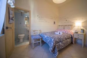 Postel nebo postele na pokoji v ubytování Albergo Etruria
