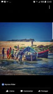 a group of people working on a boat in the water at Issablanca in Oualidia