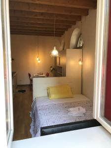 Postel nebo postele na pokoji v ubytování MyRoom Città Alta 1