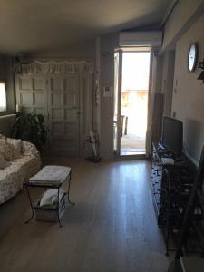 A television and/or entertainment centre at Rinidia - Siena Celso Cittadini