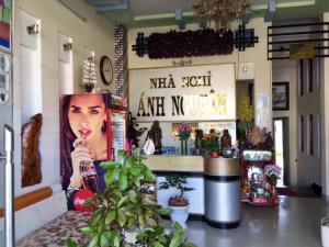 a store with a poster of a woman on the wall at Anh Nguyen Guesthouse in Pleiku