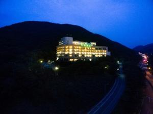 a large building is lit up at night at Bugok Ilsung Condo in Changnyeong