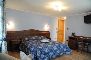 Säng eller sängar i ett rum på La Maison de Franco